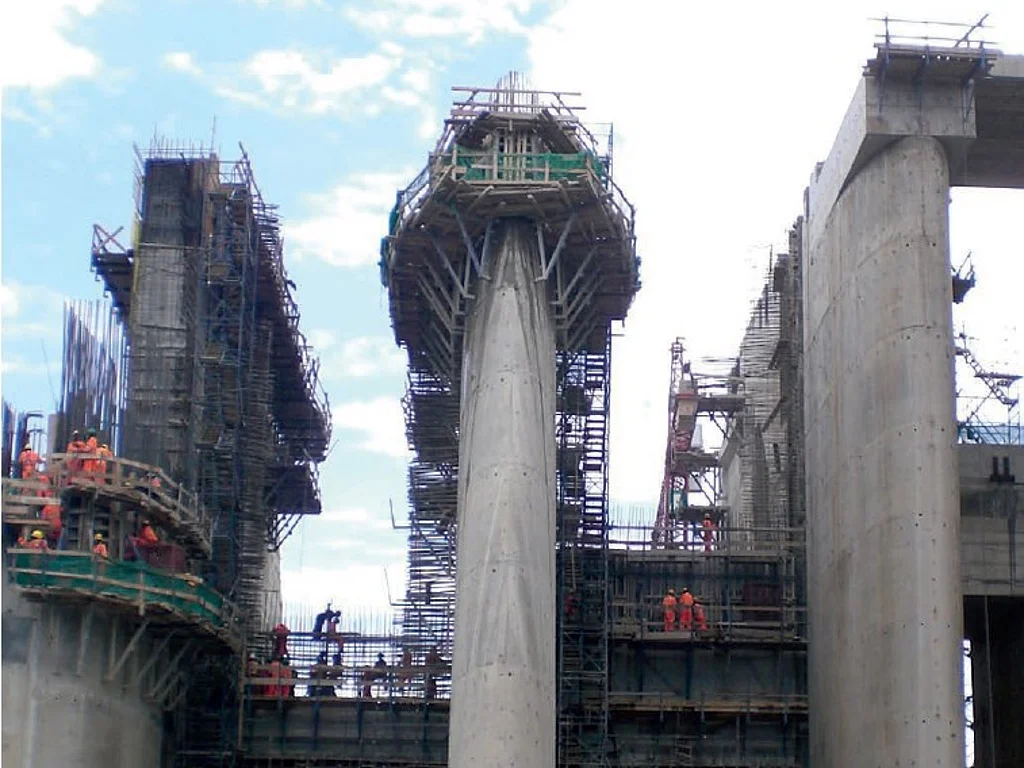 Tall concrete piers under construction at a hydropower project
